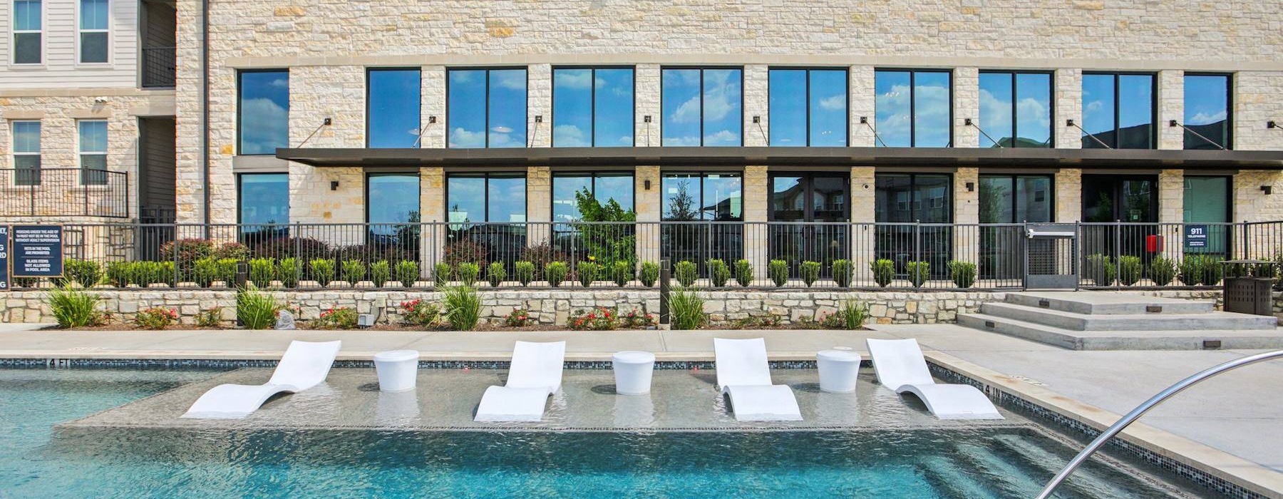 pool with lounge chairs